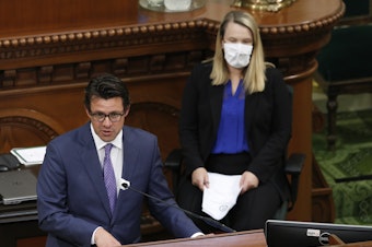 caption: Legislative Analyst Gabriel Petek, left, discusses Gov. Gavin Newsom's proposed 2020-21 revised state budget during a hearing the state Capitol in Sacramento, Calif., May 26, 2020. On Thursday, Dec. 7, 2023, Petek said California is facing a $68 billion budget deficit.