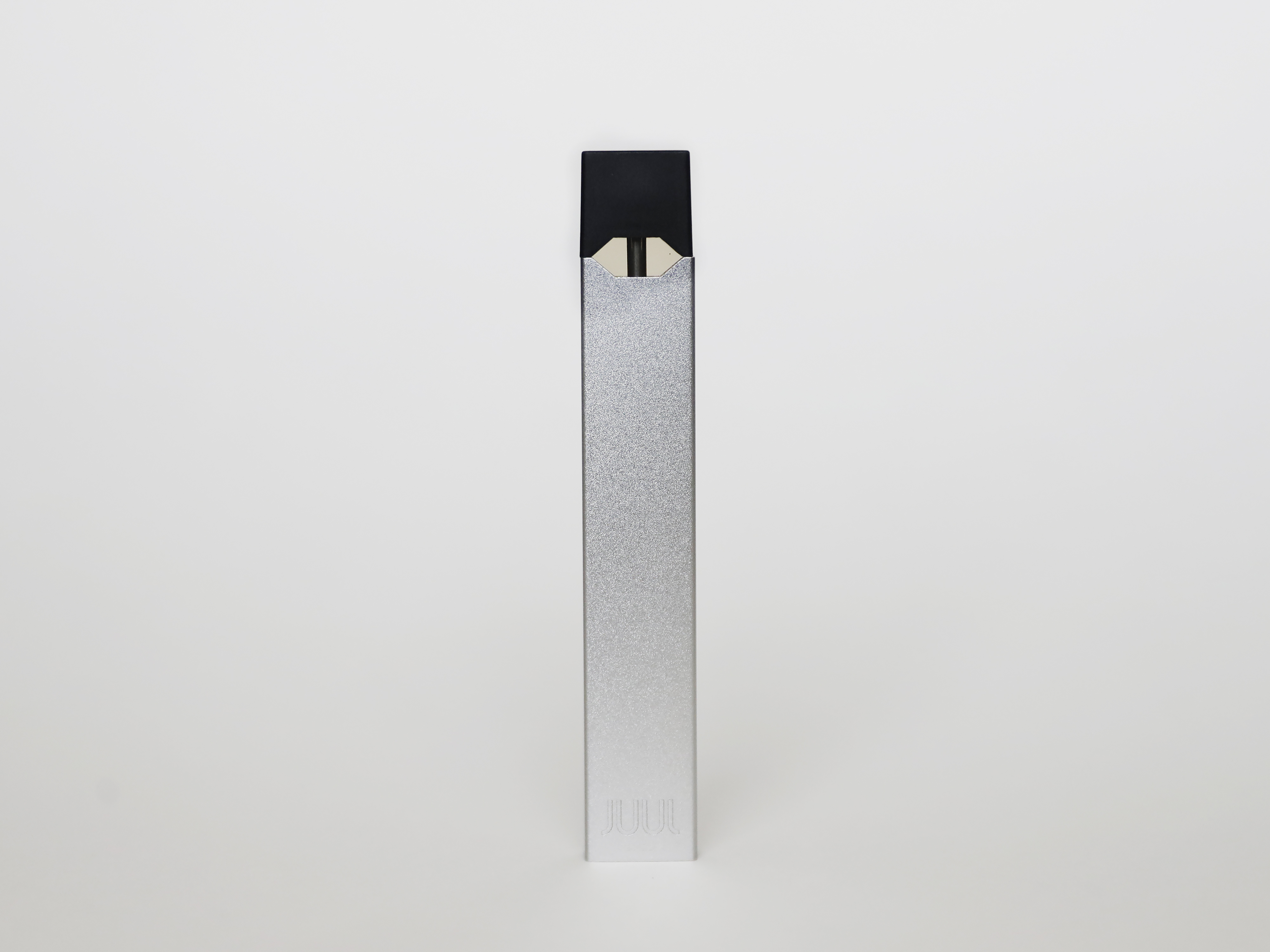 caption: An electronic cigarette from Juul Labs is seen on on Feb. 25, 2020, in Pembroke Pines, Fla.