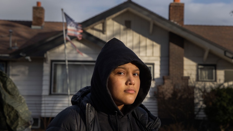 caption: Michelle Aguilar Ramirez recently moved to Spokane, Washington, from Seattle with her mom, but says she has struggled with the multiple racist incidents she's experienced since she's arrived. She walks in her neighborhood every day, but avoids certain areas where neighbors fly confederate flags or Make America Great Again signs.