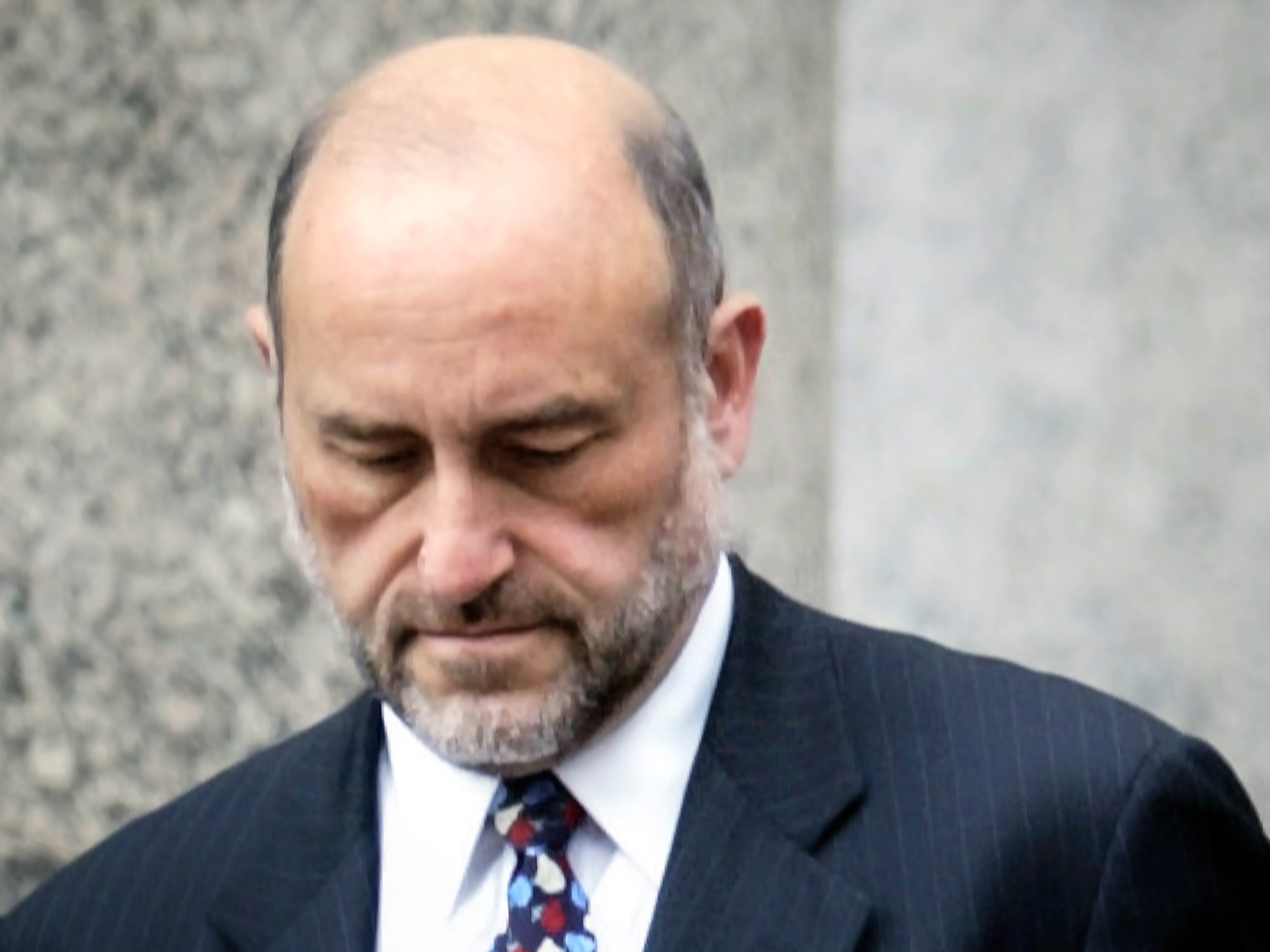 caption: Attorney Mark Pomerantz is shown leaving court in New York on Sept. 8, 2004.