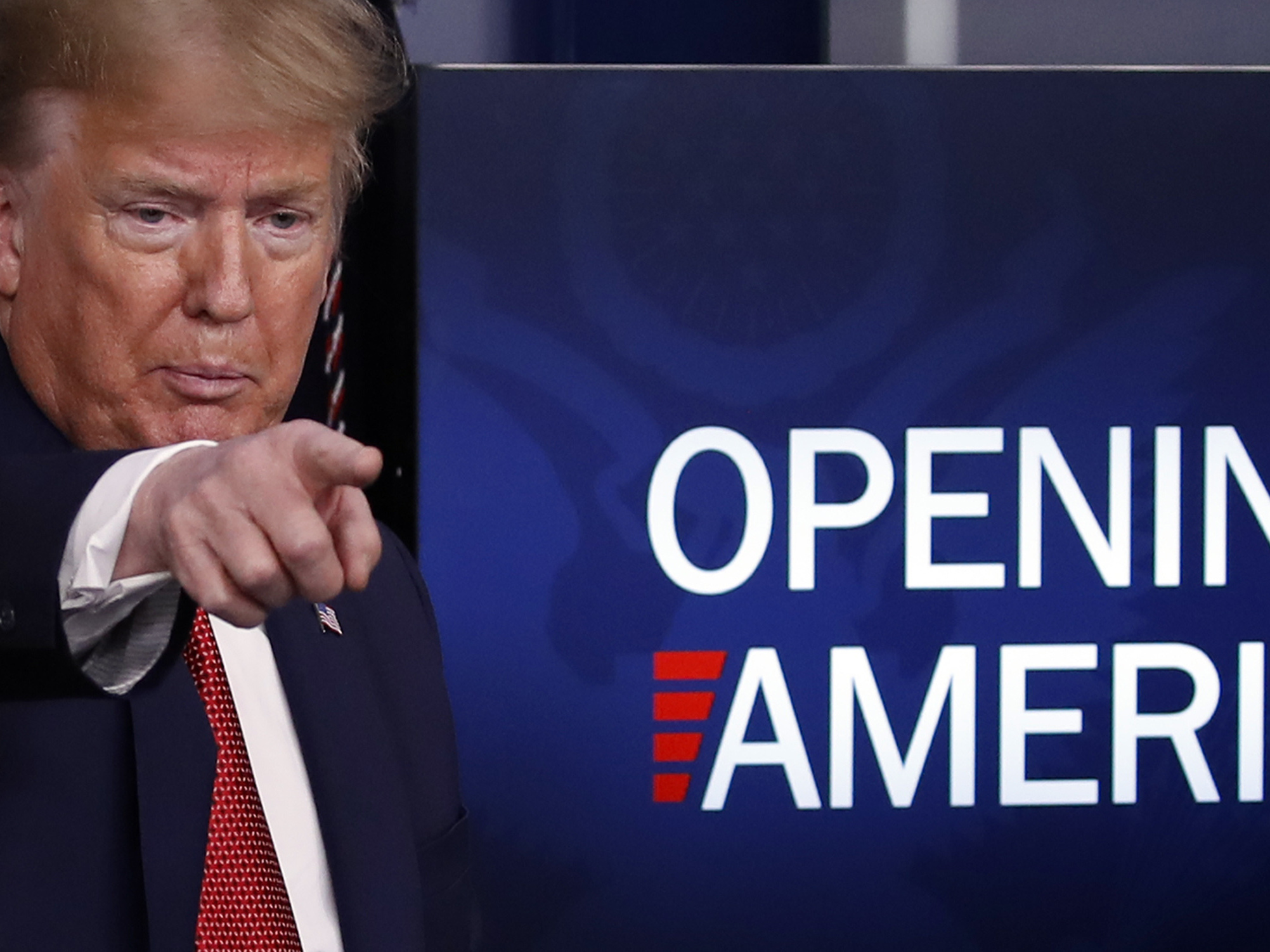 caption: President Donald Trump speaks about the coronavirus on Thursday. Governors were mixed in their response to the federal government's plan to reopen America.