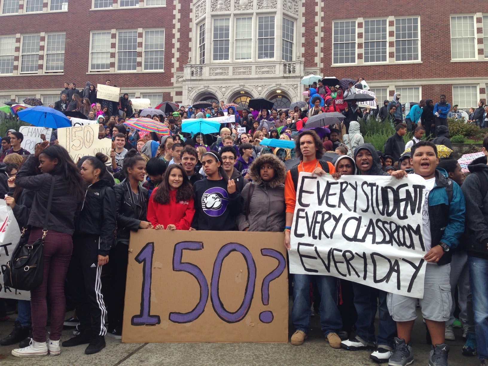 caption: To the beat of the school drumline, Garfield High School students poured out of school at 1:50 to protest a teacher cut that could affect an estimated 150 students.