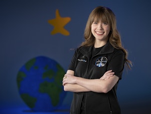 caption: A photo provided by St. Jude Children's Research Hospital shows Hayley Arceneaux at the hospital in Memphis, Tenn. It announced on Monday that Arceneaux, a former patient and current employee, will be one of four crew members on the first all-civilian space flight this year.