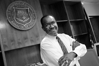 caption: James F. Holmes, the first-ever person of color to oversee the U.S. head count, stands inside his office at the Census Bureau's former headquarters in Suitland, Md., in 1998, when Holmes served as acting director for about nine months.
