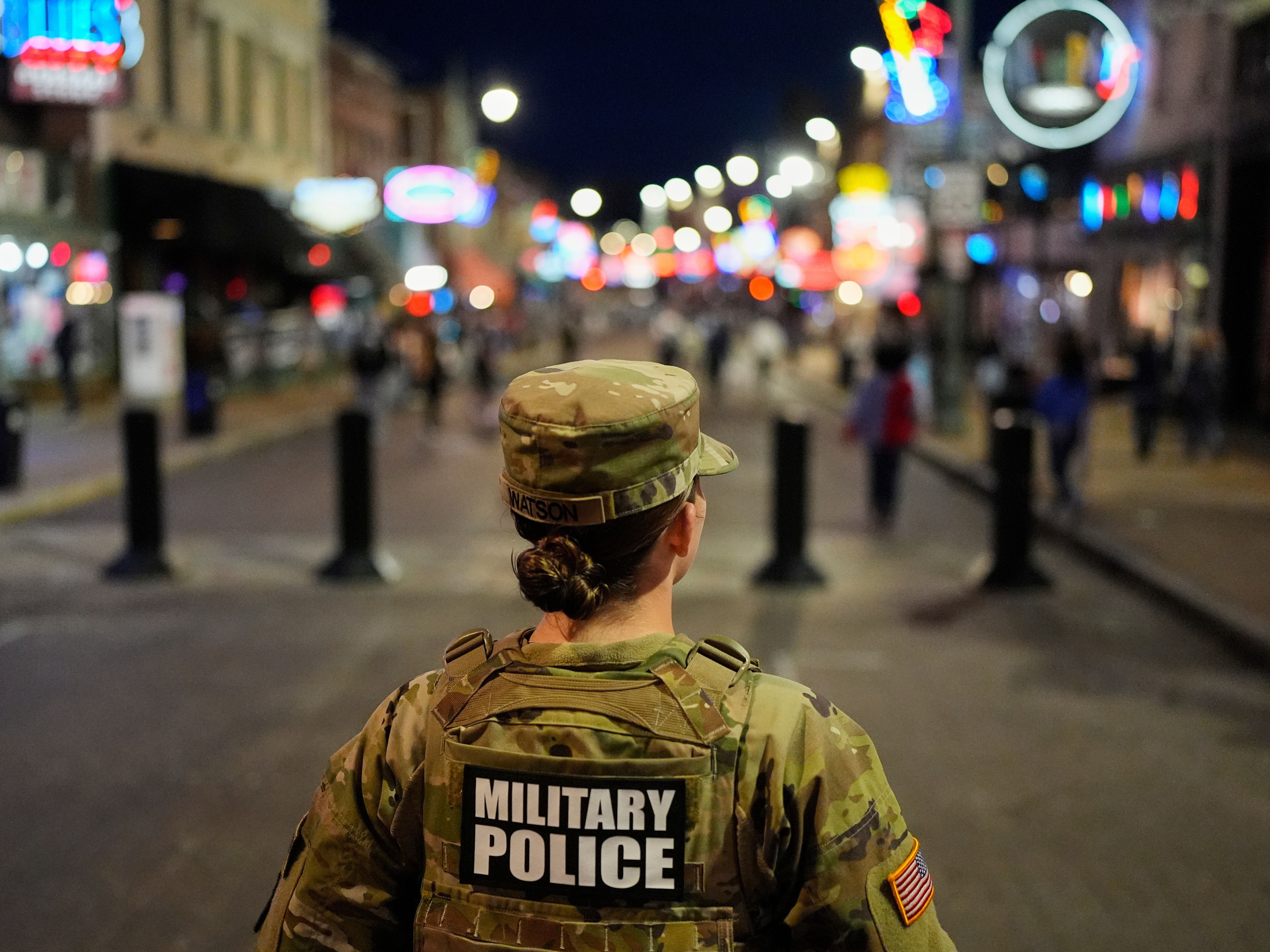caption: A member of the National Guard stands watch on Beale Street in Memphis, Tenn. on Oct. 24.