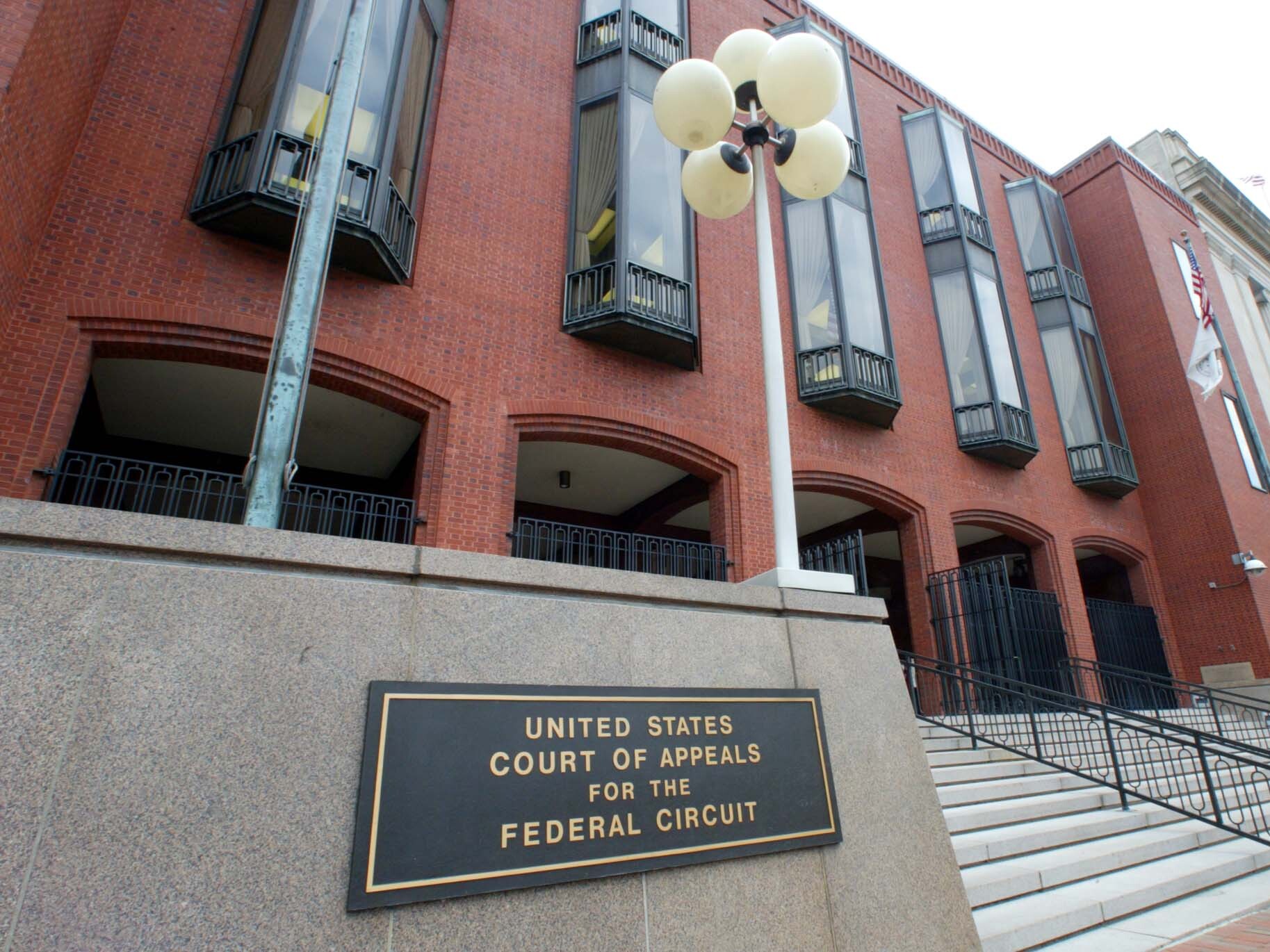 caption: This photo shows an exterior view of the U.S. Court of Appeals for the Federal Circuit building from 2002 in Washington, D.C.
