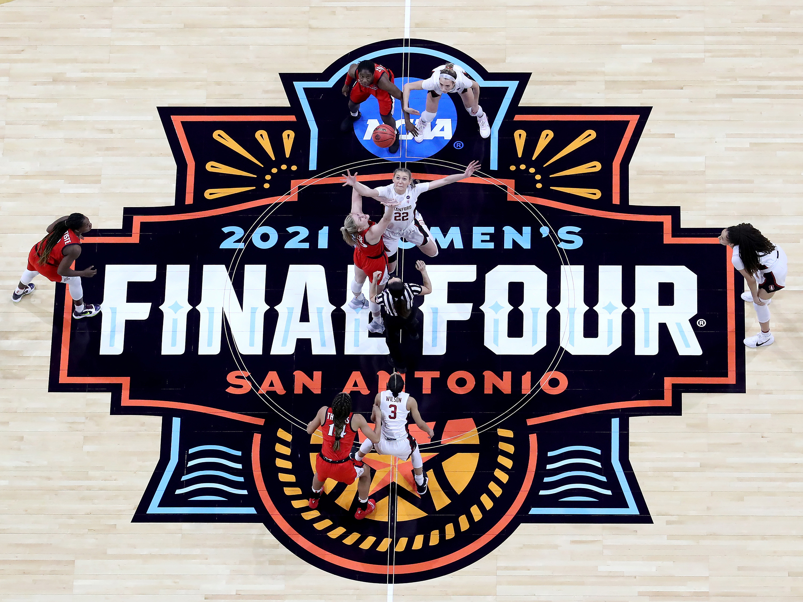 caption: Cameron Brink #22 of the Stanford Cardinal and Cate Reese #25 of the Arizona Wildcats fight for the opening tipoff during the National Championship game of the 2021 NCAA Women's Basketball Tournament at the Alamodome on April 4 in San Antonio, Texas. The Stanford Cardinal defeated the Arizona Wildcats 54-53 to win the national title.