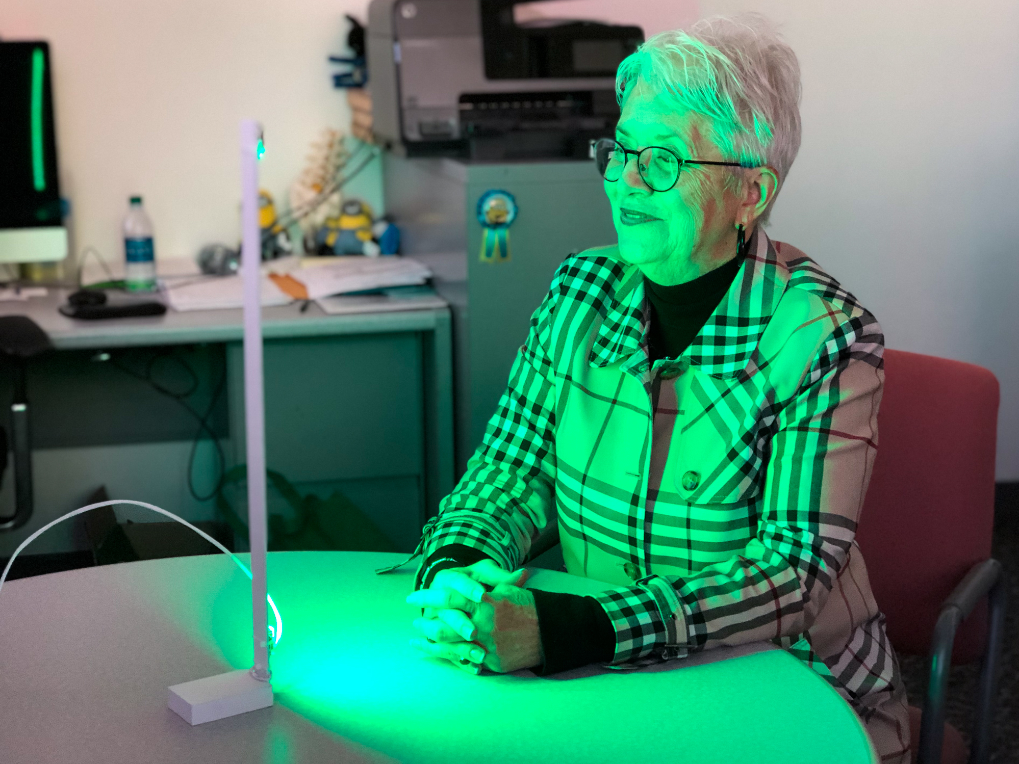 caption: Ann Jones has been spending two hours each day in front of a green LED light — an experimental treatment aimed at alleviating migraines and other forms of chronic pain.