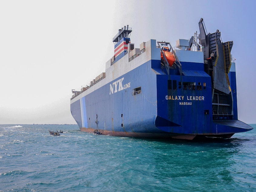 caption: The Galaxy Leader cargo ship was seized by Houthi fighters in the Red Sea in late November. The Bahamas-flagged, British-owned Galaxy Leader, operated by a Japanese firm but having links to an Israeli businessman, was headed from Turkey to India when it was seized and rerouted to the Yemeni port of Hodeida.