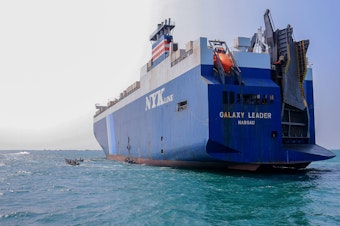 caption: The Galaxy Leader cargo ship was seized by Houthi fighters in the Red Sea in late November. The Bahamas-flagged, British-owned Galaxy Leader, operated by a Japanese firm but having links to an Israeli businessman, was headed from Turkey to India when it was seized and rerouted to the Yemeni port of Hodeida.