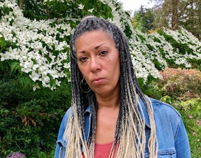 caption: Angel Graves, a student and family advocate in Seattle Public Schools, stands for a portrait on June 23, 2020.