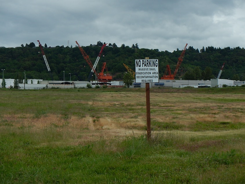 caption: A warning sign at a vacant lot at the Port of Tacoma