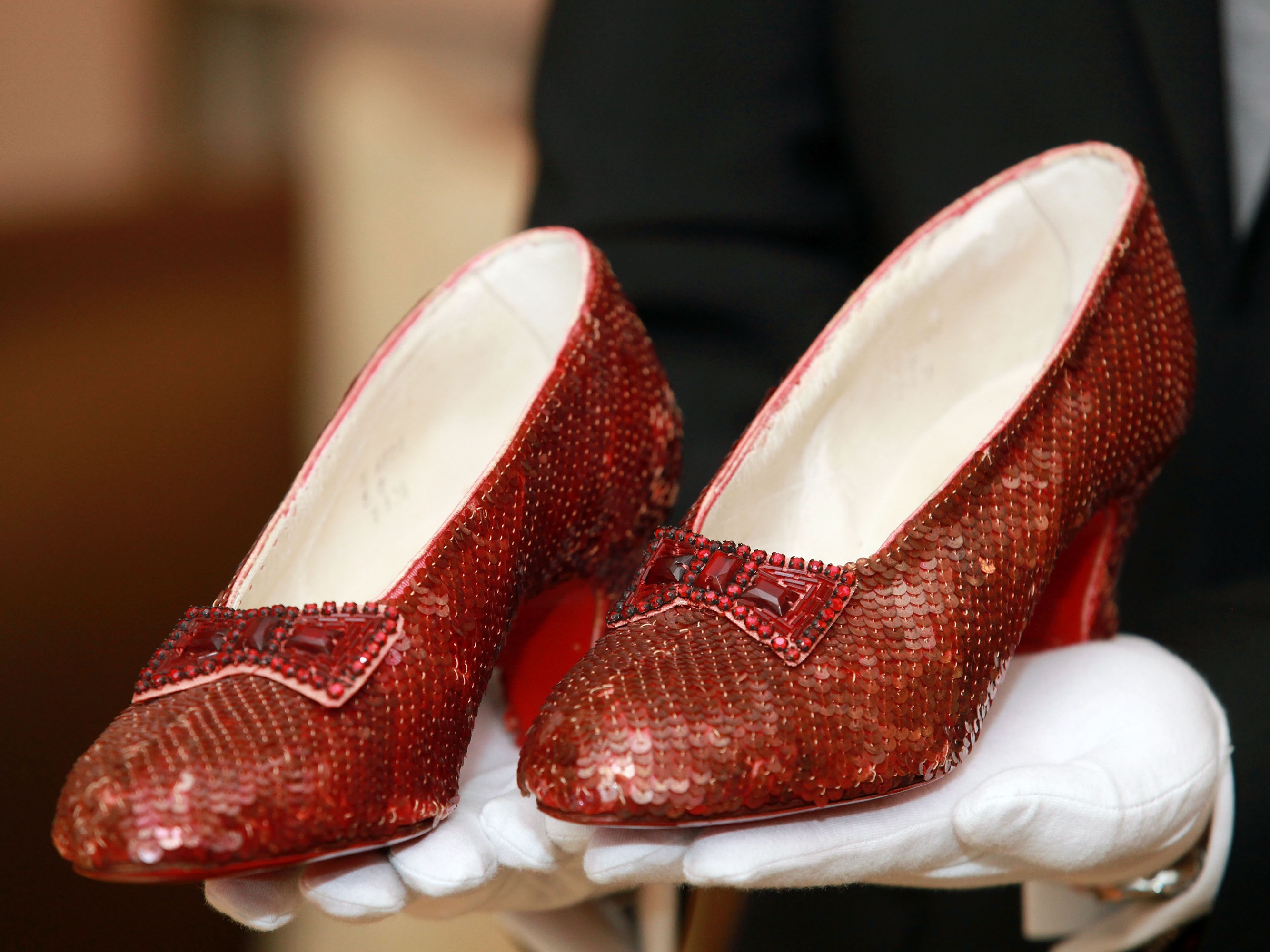 caption: One pair of Dorthy's slippers, worn by Judy Garland in 1939, are displayed at a viewing at the Plaza Athenee on December 5, 2011 in New York City. 