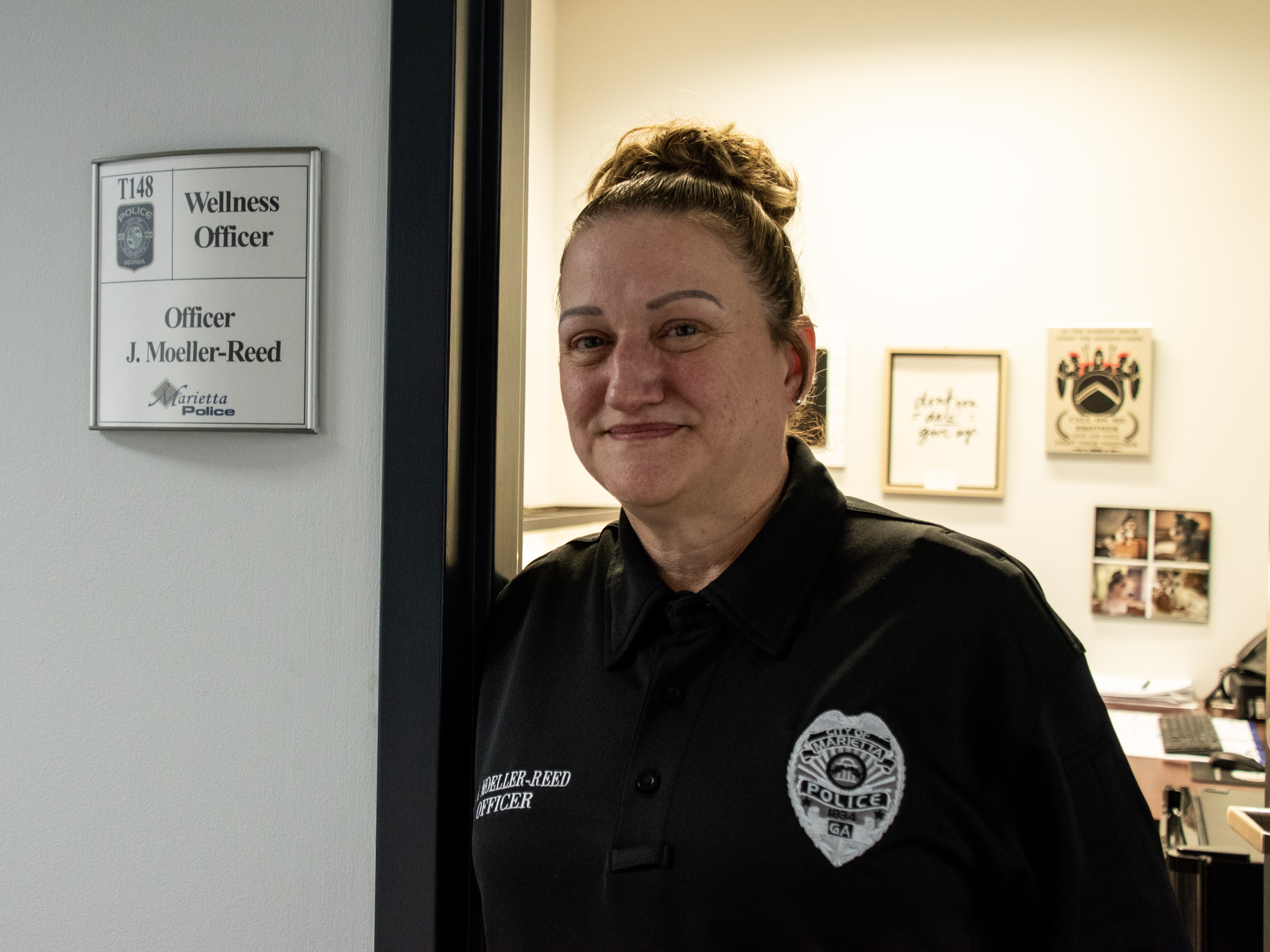 caption: Jonnie Moeller-Reed is the wellness officer at the Marietta Police Department in suburban Atlanta. In her role, she oversees programs that build resiliency and help cops who struggle with stress, burnout and trauma.