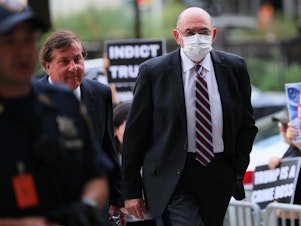 caption: Former Trump Organization chief financial officer Allen Weisselberg arrives for a hearing on his criminal case at Manhattan Criminal Court on Aug. 12 in New York City. The Manhattan District Attorney's office is charging Weisselberg and the Trump Organization with tax fraud after being accused of paying employees "off the books" in order to pay less taxes. Weisselberg has pleaded not guilty.