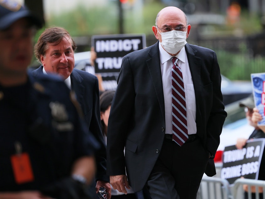 caption: Former Trump Organization chief financial officer Allen Weisselberg arrives for a hearing on his criminal case at Manhattan Criminal Court on Aug. 12 in New York City. The Manhattan District Attorney's office is charging Weisselberg and the Trump Organization with tax fraud after being accused of paying employees "off the books" in order to pay less taxes. Weisselberg has pleaded not guilty.