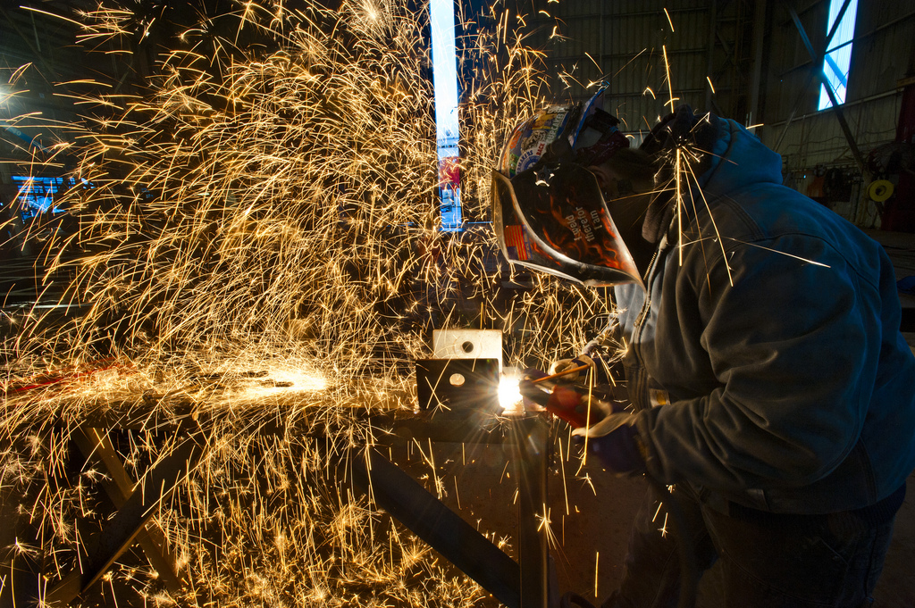 caption: A welder at Vigor Industrial works on a new ferry for the Washington State Ferry System.