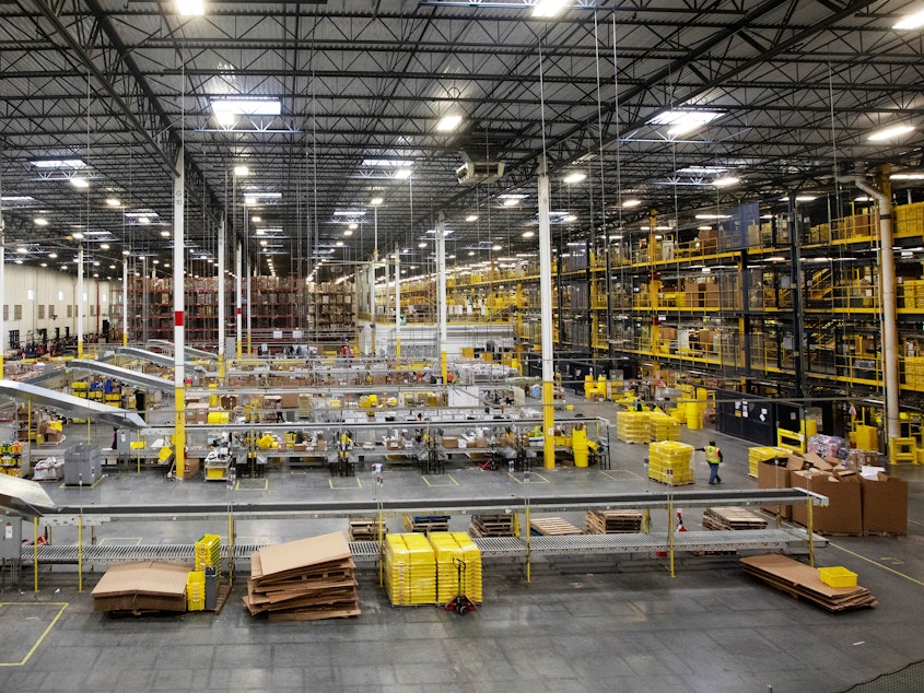 caption: Workers at an Amazon fulfillment center in Robbinsville, N.J., were sickened on Wednesday after an automated machine punctured a can of bear repellent. The warehouse is seen here in June.