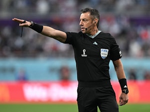 caption: Brazilian referee Raphael Claus gestures during the Qatar 2022 World Cup soccer match between England and Iran at the Khalifa International Stadium in Doha on Monday. Claus added 29 minutes of stoppage time to the game - part of a growing trend at this tournament.