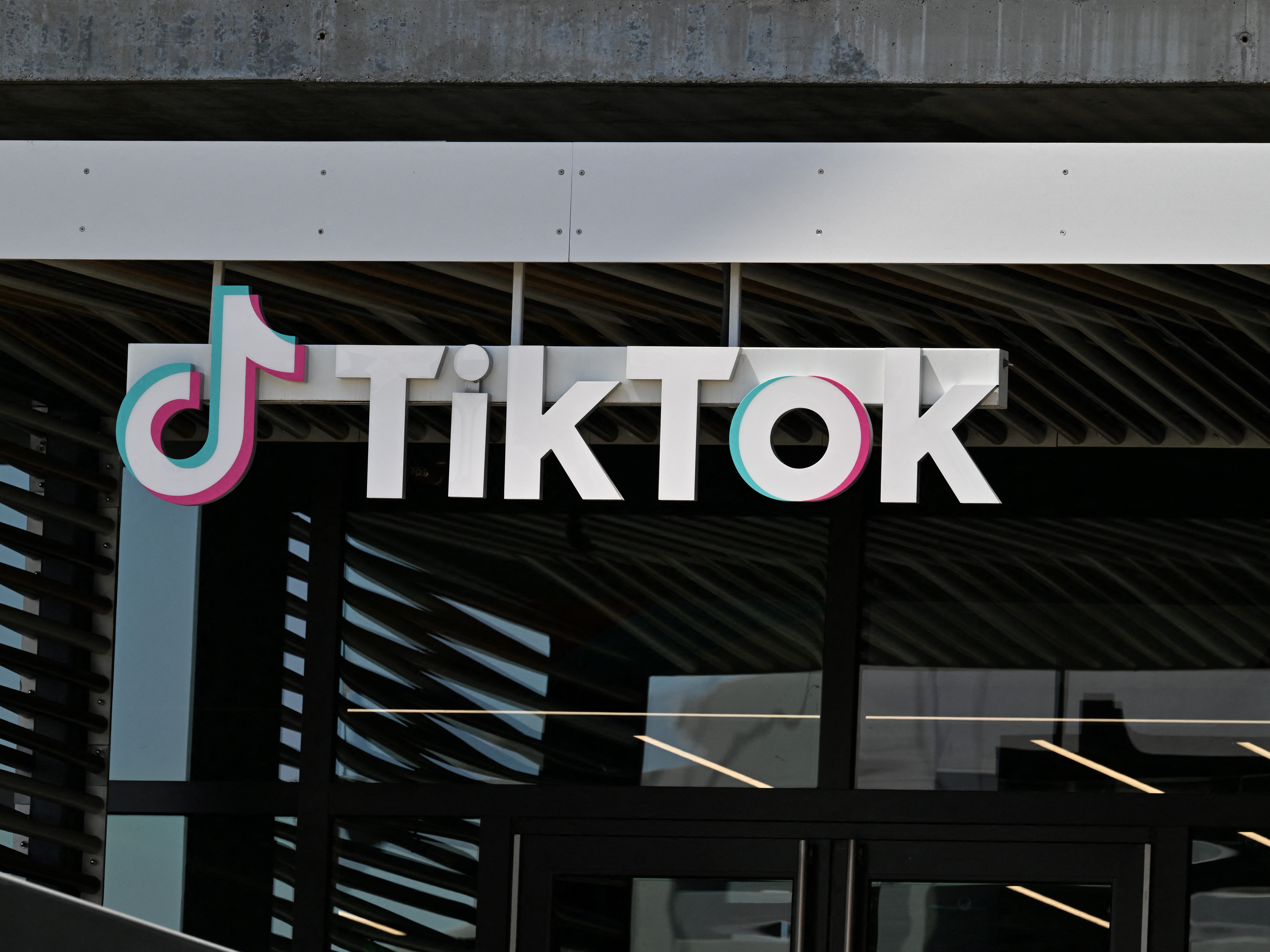 caption: The TikTok logo is seen outside the Chinese video app company's Los Angeles offices on April 4, 2025 in Culver City, California.