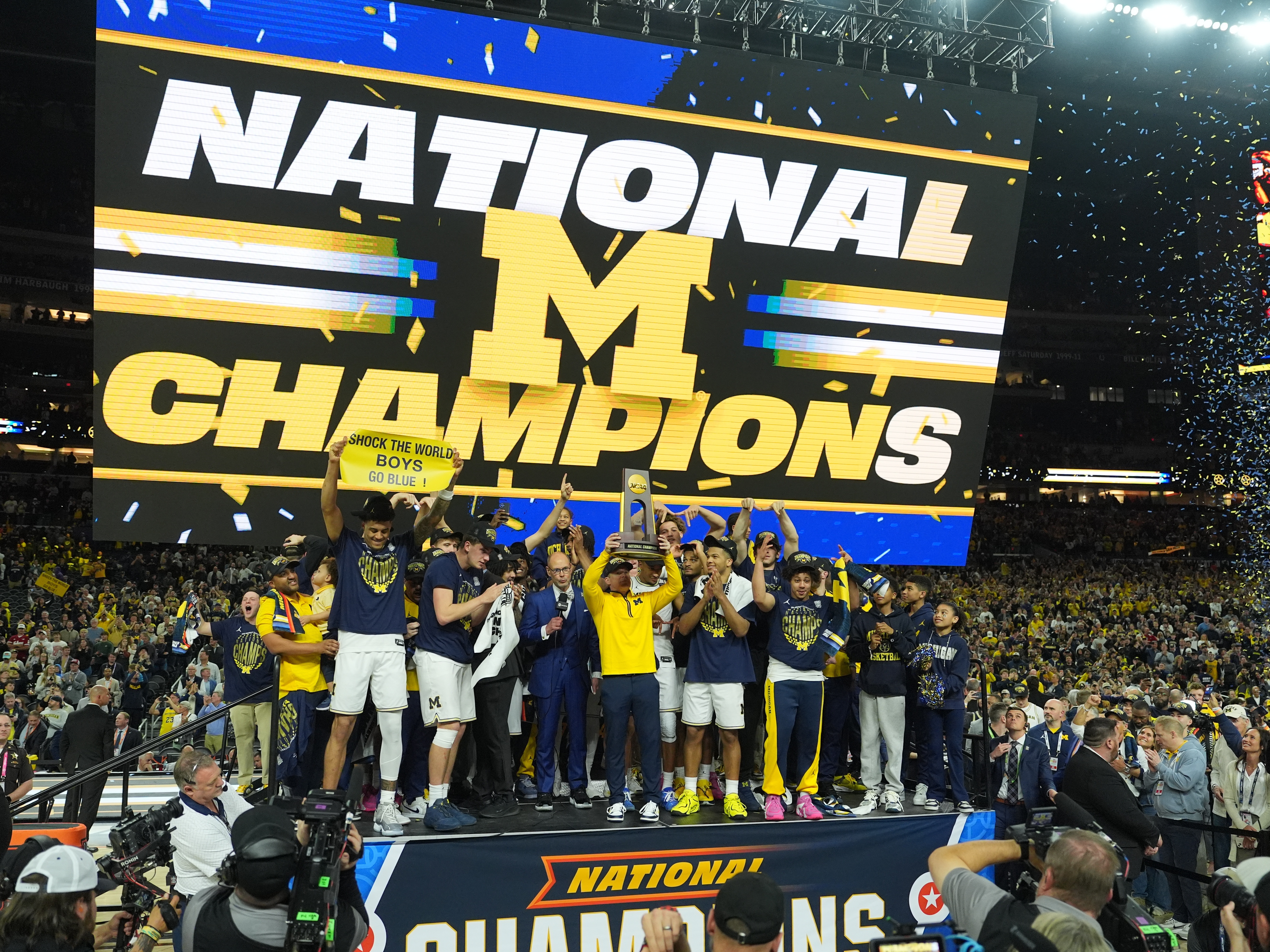caption: Michigan celebrates after defeating UConn in the NCAA college basketball tournament national championship game at the Final Four, Monday, April 6, 2026, in Indianapolis.