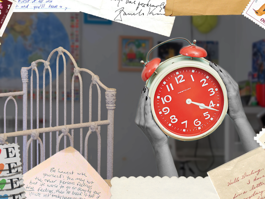 A collage of a clock and a crib surrounded by stamps and stationary elements.