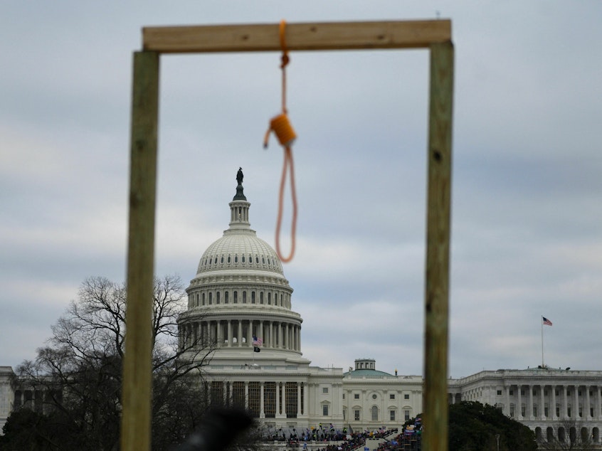 caption: A noose is seen on makeshift gallows as supporters of Donald Trump rioted at the U.S. Capitol on Jan. 6, 2021.