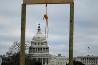 caption: A noose is seen on makeshift gallows as supporters of Donald Trump rioted at the U.S. Capitol on Jan. 6, 2021.