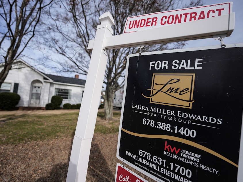 caption: A home for sale sign on Tuesday, Jan. 16, 2024, in Kennesaw, Ga. On Friday, the National Association of Realtors reported that 2023 saw the smallest number of home sales in nearly 30 years.