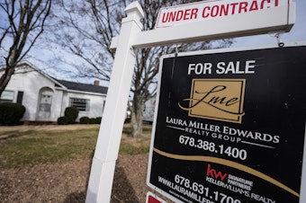 caption: A home for sale sign on Tuesday, Jan. 16, 2024, in Kennesaw, Ga. On Friday, the National Association of Realtors reported that 2023 saw the smallest number of home sales in nearly 30 years.