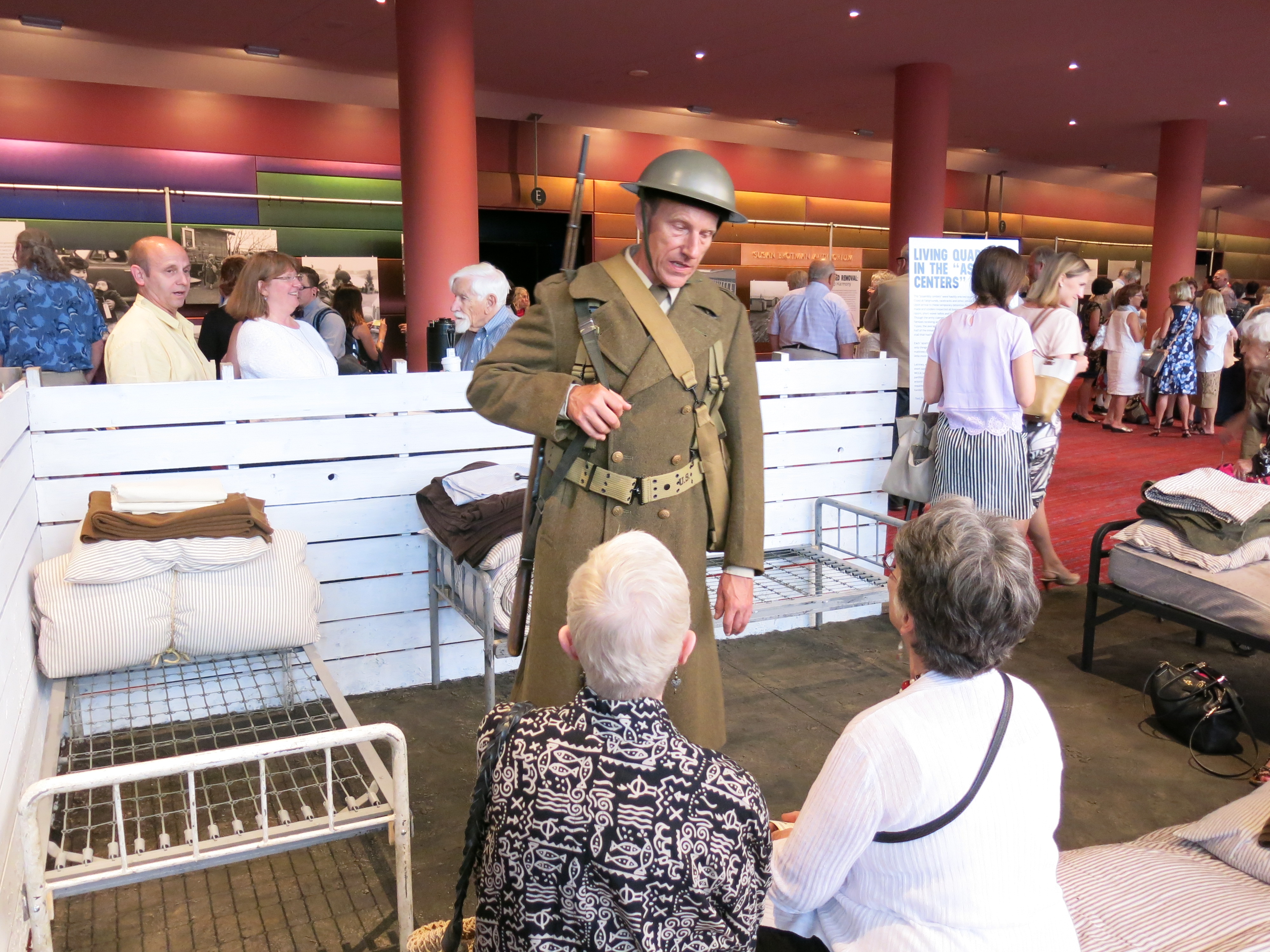 caption: Operagoers visit replica of horse stall where Japanese-American families were housed en route to camps.