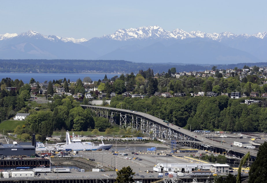 caption: Seattle's Magnolia Bridge is seen in view of the Olympic Mountains Wednesday, April 30, 2014, in Seattle. 