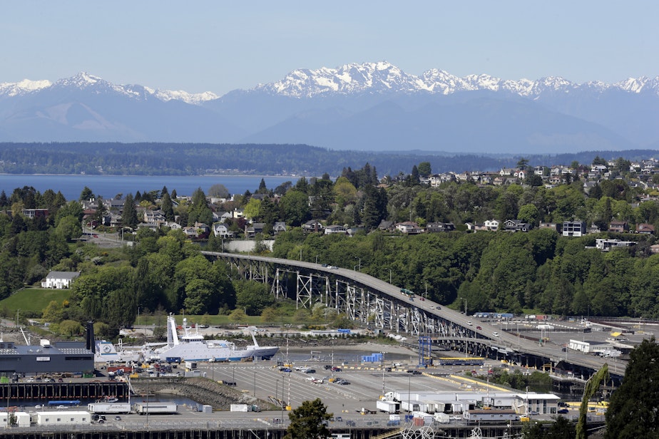 caption: Seattle's Magnolia Bridge is seen in view of the Olympic Mountains Wednesday, April 30, 2014, in Seattle. 