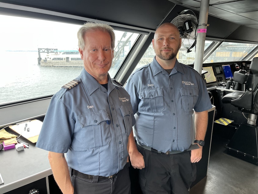 caption: Captain Dan Krehbiel and Deckhand Cory Bantam on the MV Doc Maynard, a King County water taxi, in downtown Seattle on Saturday, November 4, 2023. They used the water taxi to intercept a runaway barge headed for downtown Seattle.