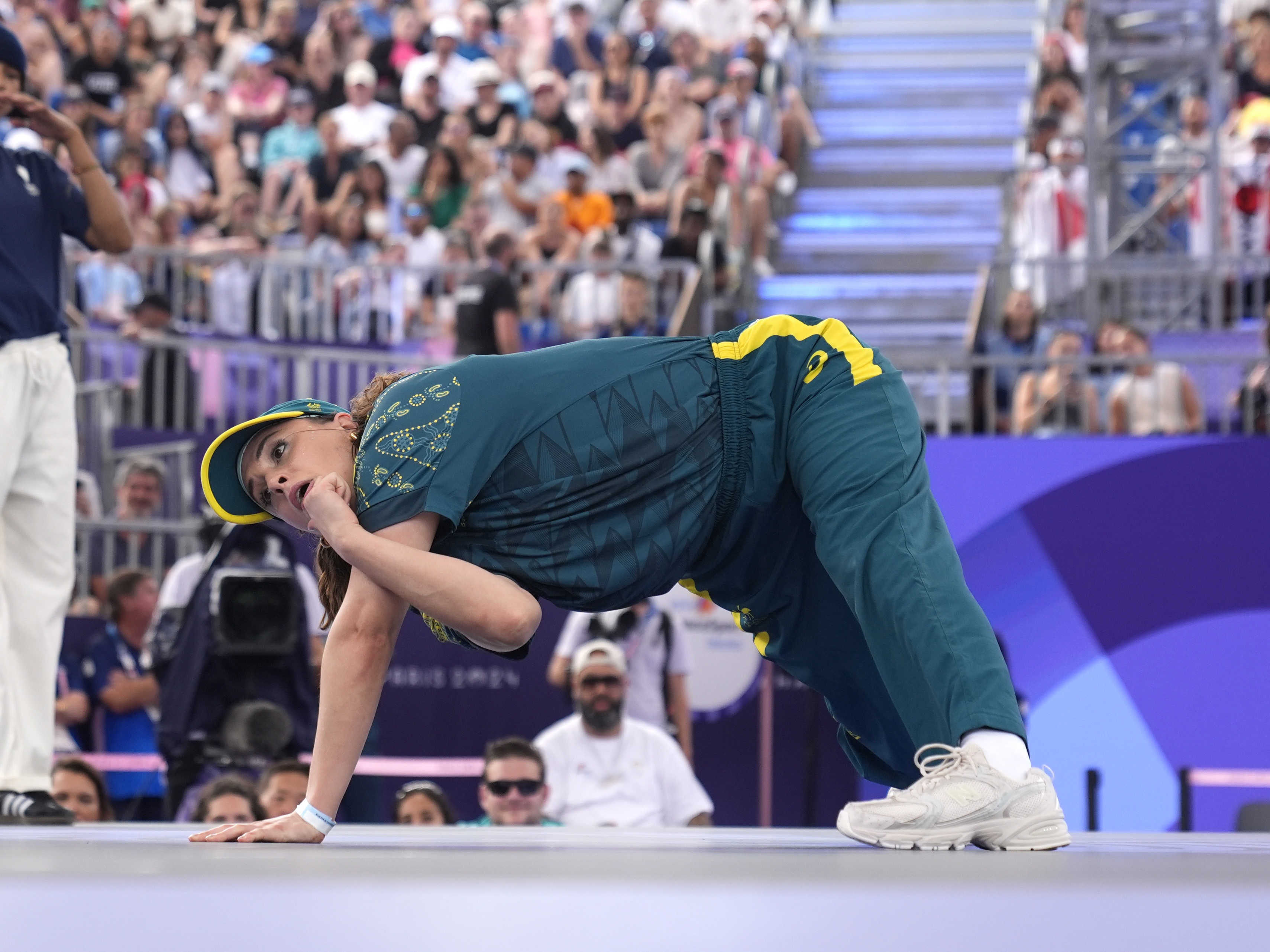 caption: Australia's Rachael Gunn, known as B-Girl Raygun, competes during the Round Robin Battle at the breaking competition at La Concorde Urban Park at the 2024 Summer Olympics on Aug. 9, 2024, in Paris, France. Her performance drew laughs and criticism and now Gunn is responding.