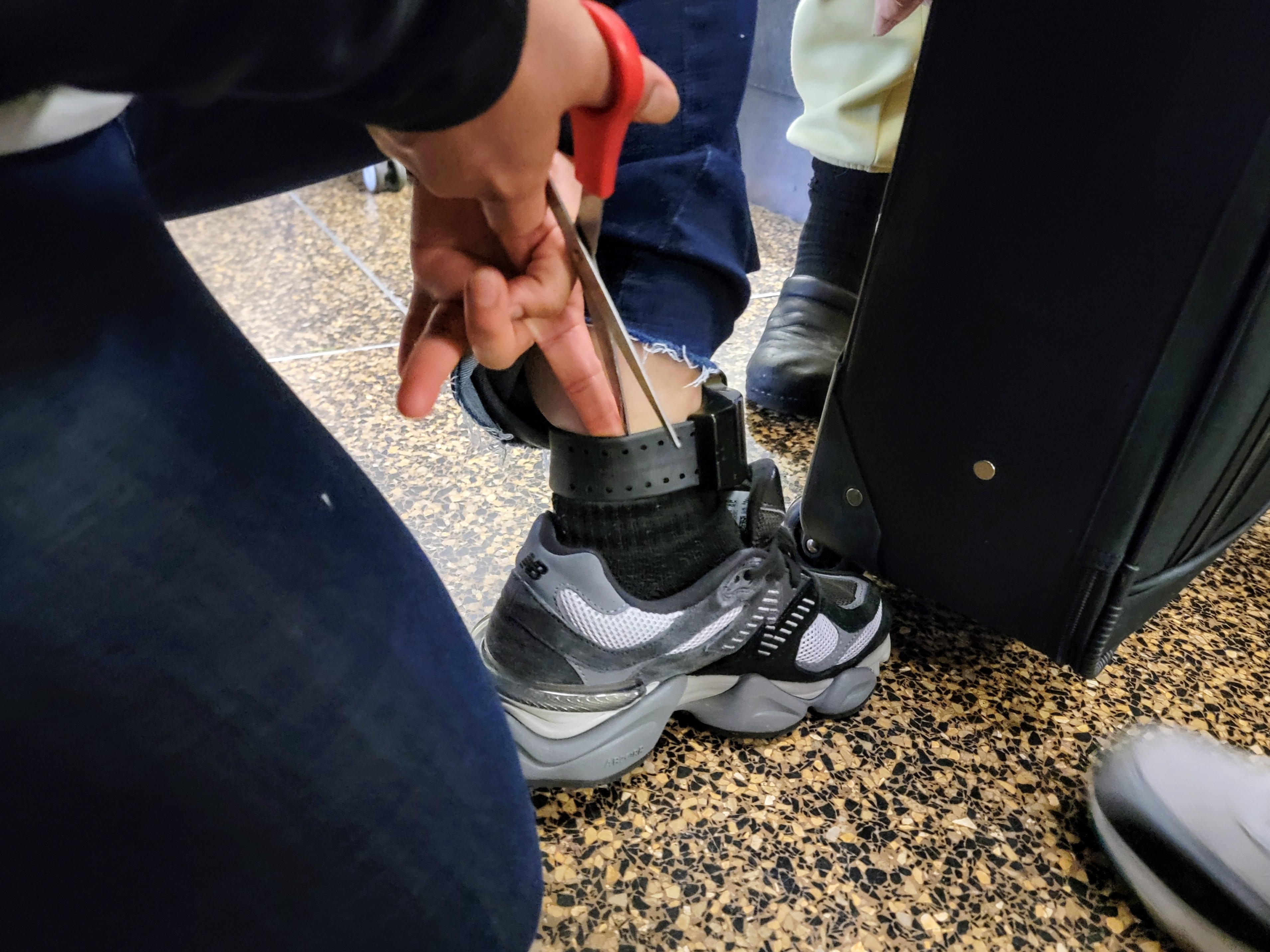 caption: Darlin was nervous about removing her ankle monitor before her flight. She said ICE told her to just leave it at Sea-Tac Airport and an ICE agent would retrieve it later.
