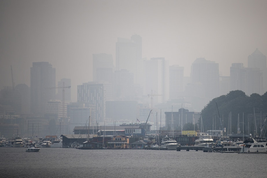 caption: Smoke shrouds Seattle's Lake Union on Monday.