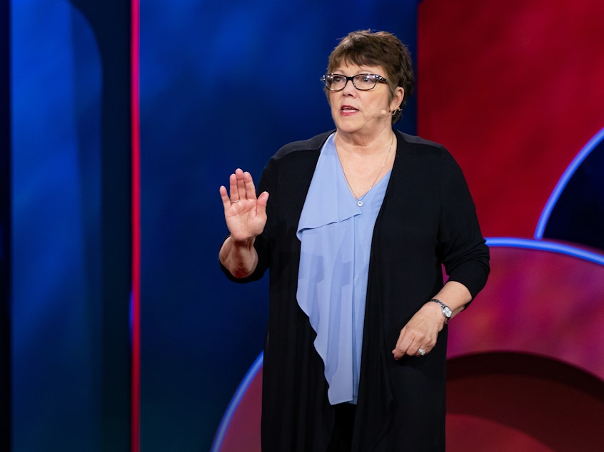 caption: Lindy Lou Isonhood on the TED stage.