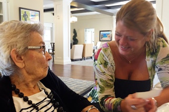 caption: Nancy Gustafson (right), an opera singer, used singing to reconnect with her mother, Susan Gustafson, who had dementia and was barely talking. She says her mom started joking and laughing with her again after they sang together.