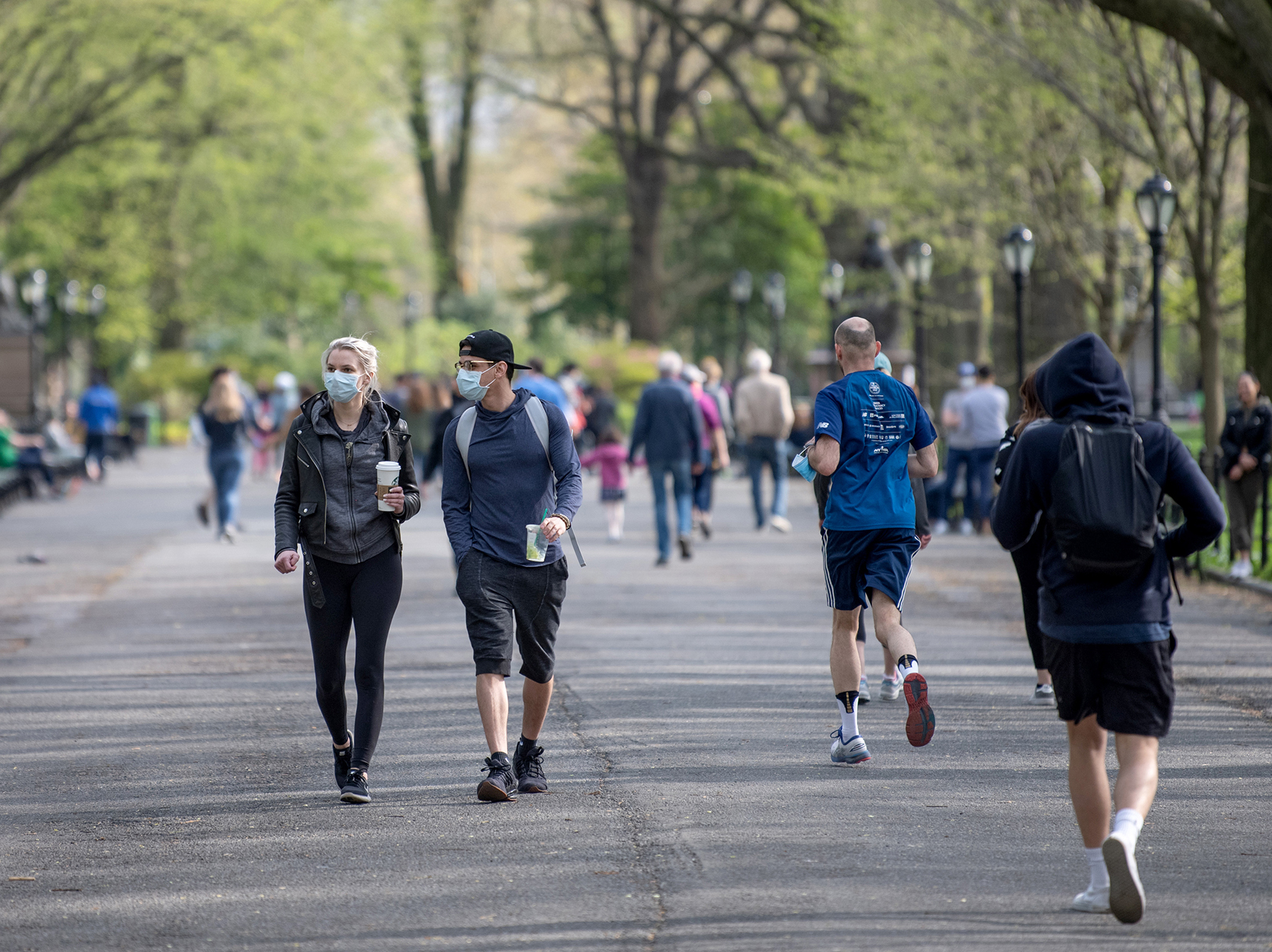 caption: The CDC says people who are fully vaccinated do not need to wear a mask when they're outdoors, unless they're in a crowded space, according to new guidance.