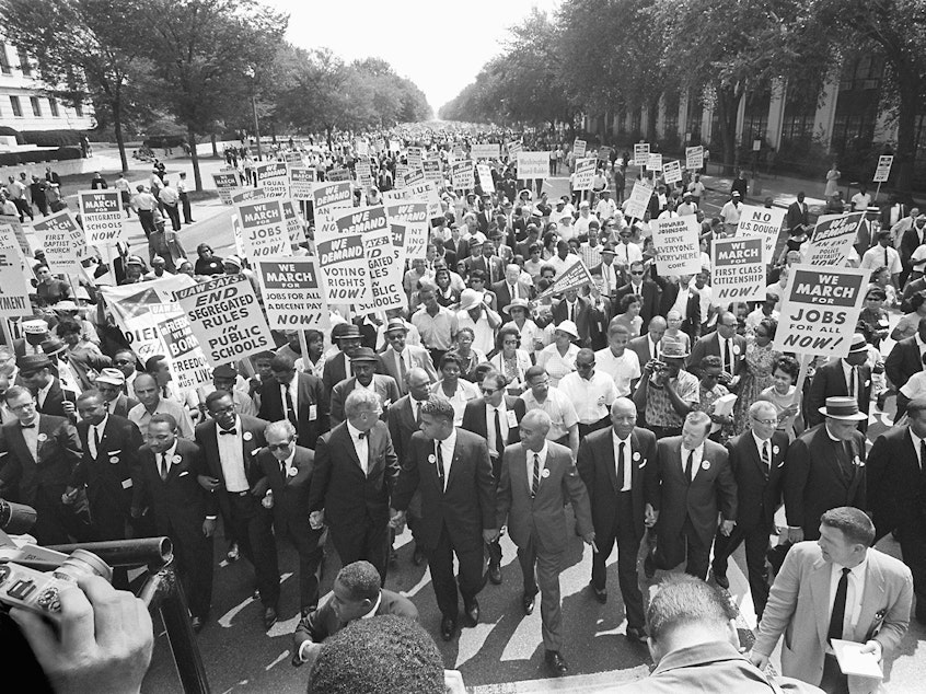 The clergyman and civil rights leader Martin Luther KIng (3rd from left) and other black and white civil right leaders march 28 August 1963 on the Mall in Washington DC during the "March on Washington".
