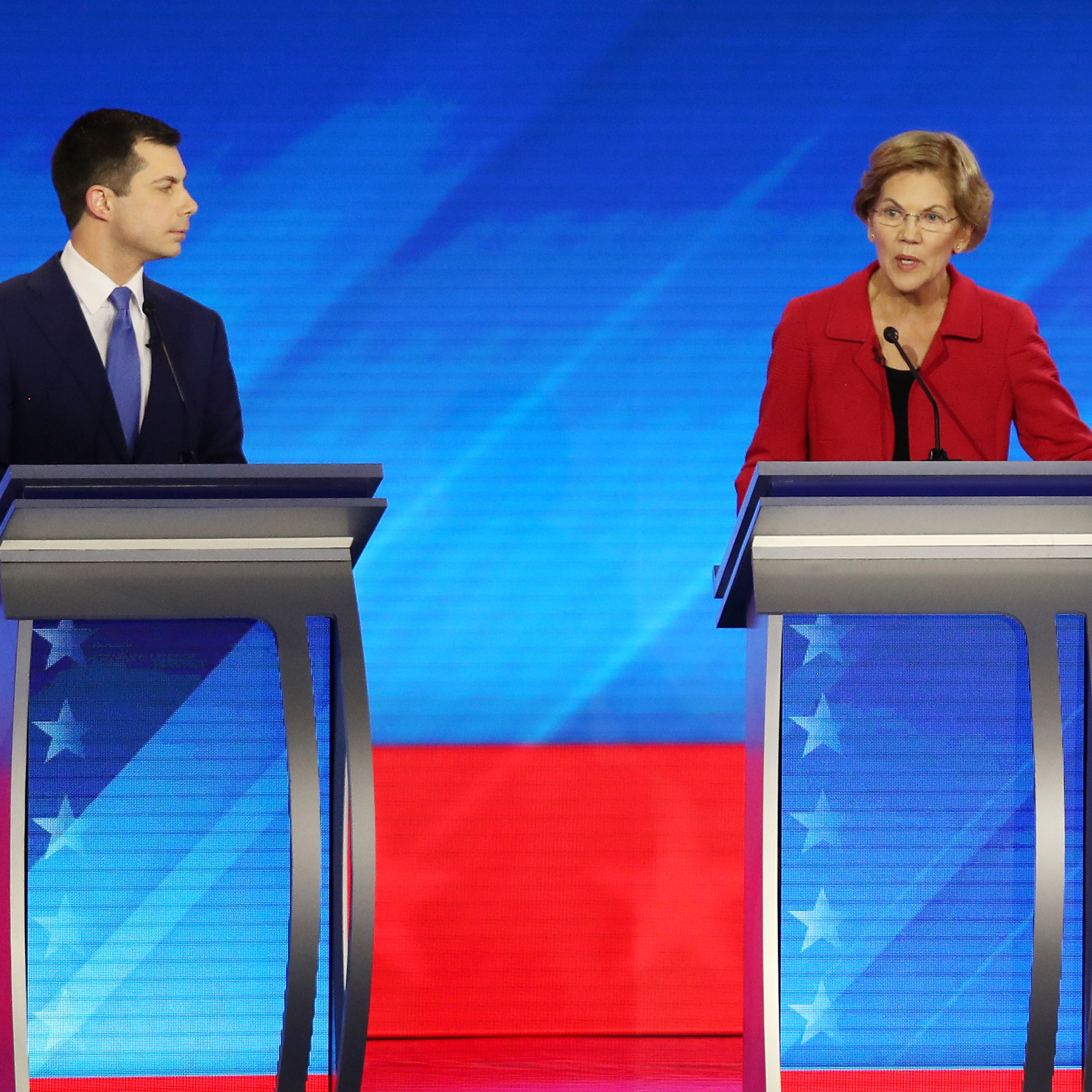 caption: Amy Klobuchar and Michael Bloomberg join these four candidates — Pete Buttigieg (left), Elizabeth Warren, Joe Biden and Bernie Sanders — onstage Wednesday night.