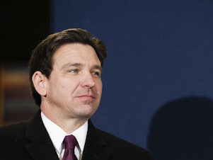 caption: Republican presidential candidate Florida Governor Ron DeSantis speaks at a campaign stop at Pub 52 on January 15, 2024 in Sergeant Bluff, Iowa.