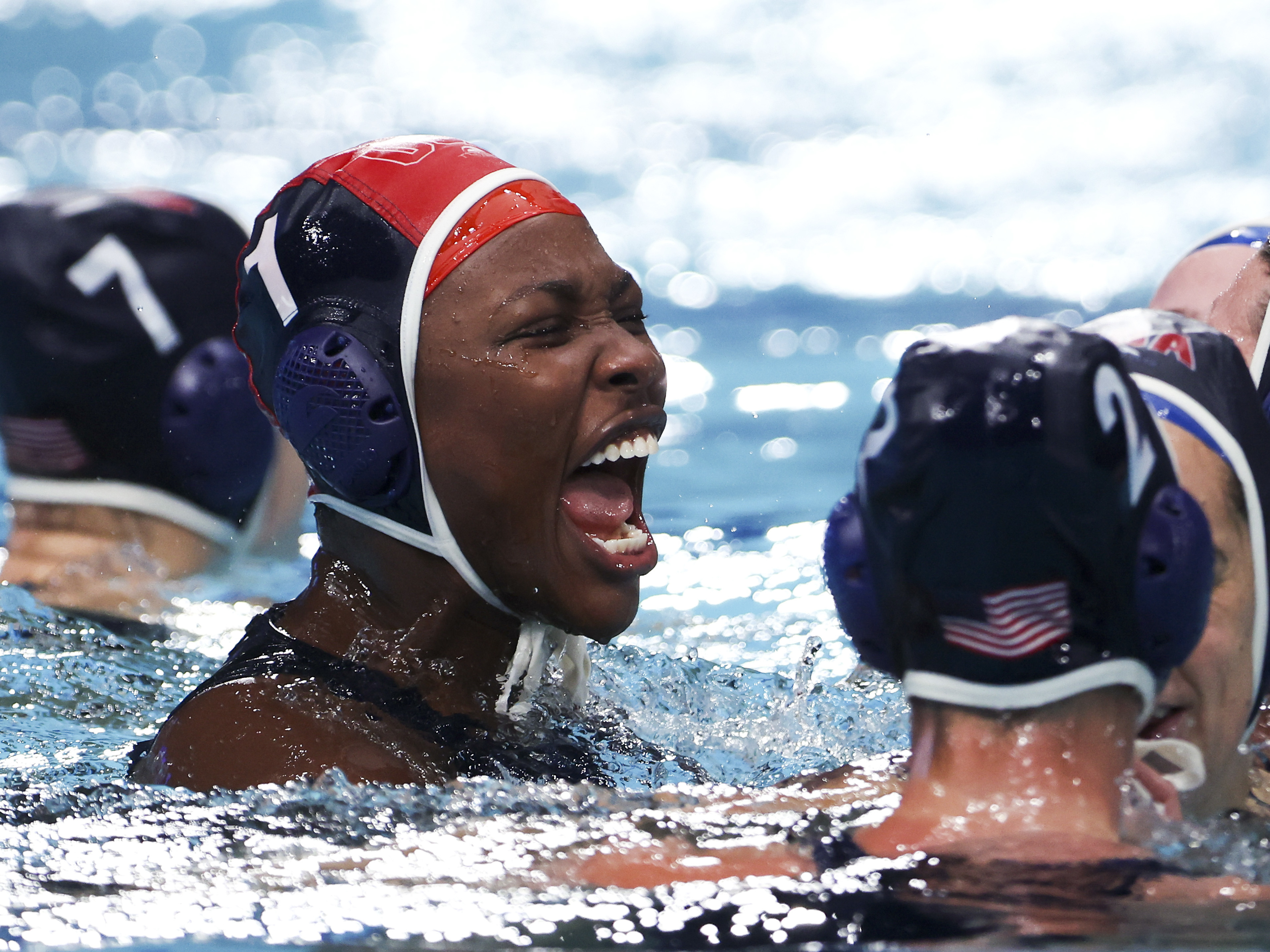 caption: Team USA goalkeeper Ashleigh Johnson celebrates a gold medal in water polo. You should probably be watching more water polo.
