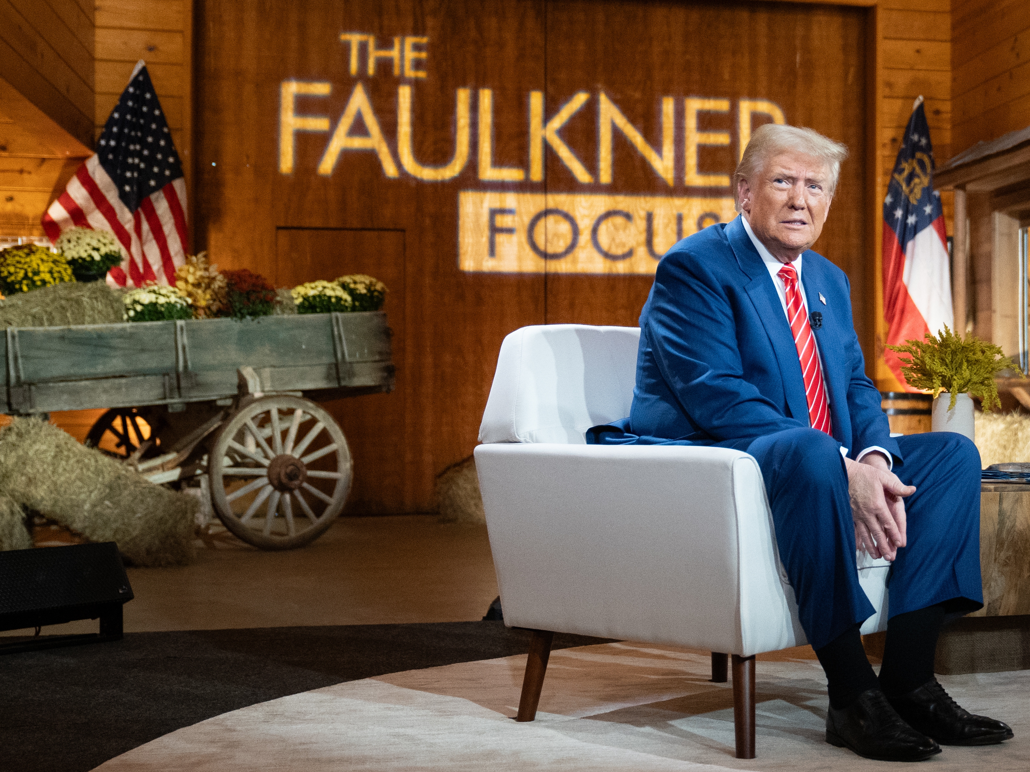 caption: Republican presidential nominee, former President Donald Trump attends a town hall event hosted by Fox News on Tuesday in Cumming, Ga., focused on women's issues.