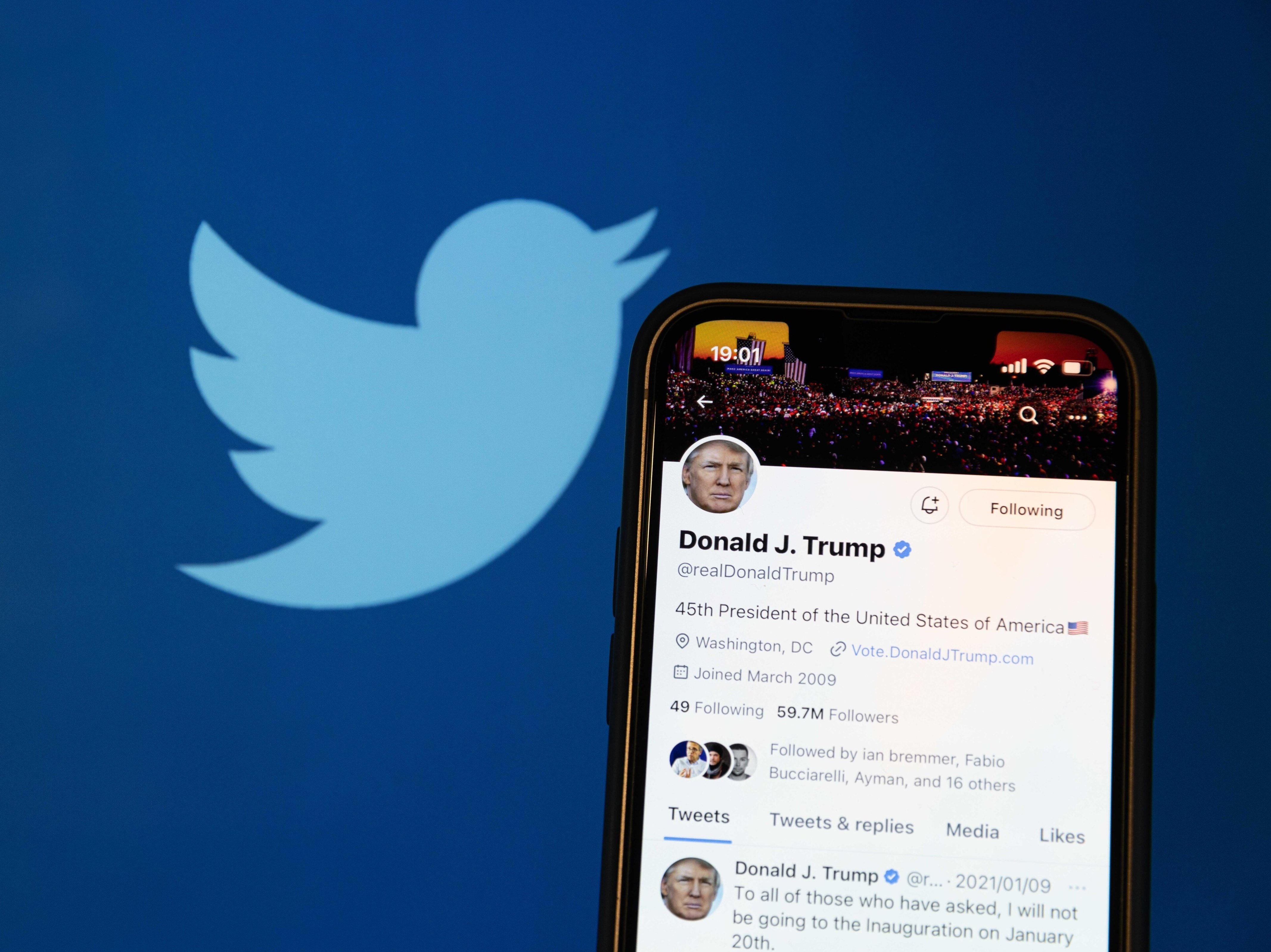 caption: A photo illustration shows the reactivated Twitter profile of former US President Donald Trump. Elon Musk reinstated him on the social media platform on November 19, 2022.