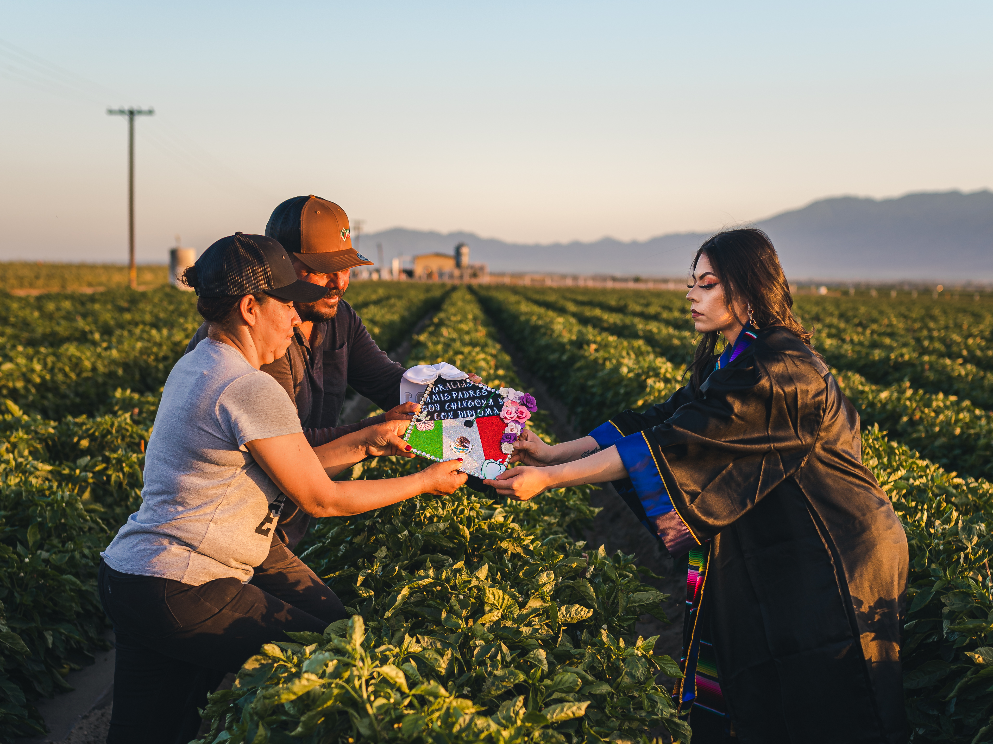 caption: When relaying why she chose the farm fields for her college graduation photo shoot, Jennifer Rocha explained it's because that's where her parents "sacrificed their backs, their sweat, their early mornings, late afternoons, working cold winters, hot summers just to give me and my sisters an education."