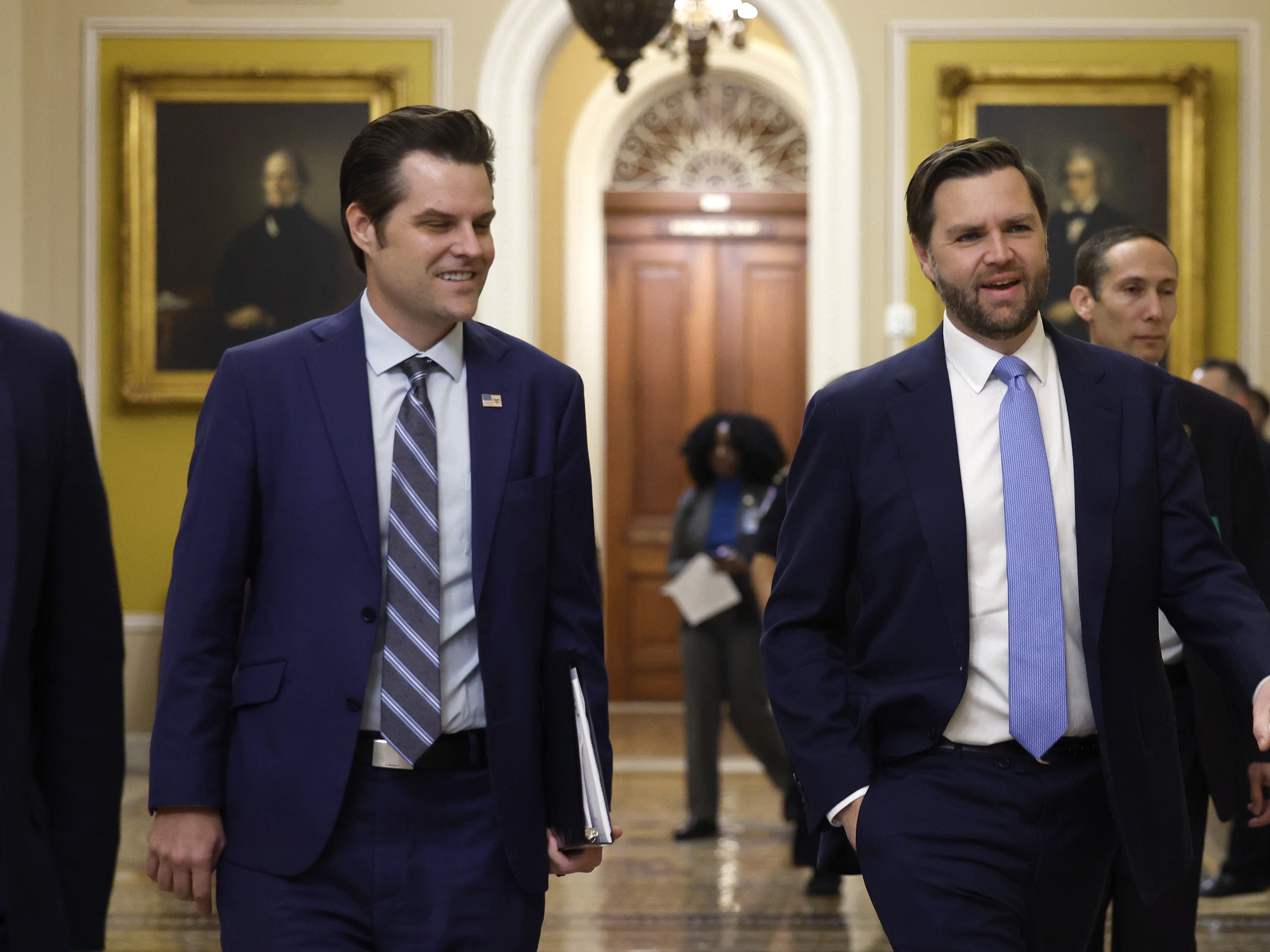 caption: Former U.S. Rep. Matt Gaetz, who President-elect Donald Trump had nominated to be attorney general, walks alongside Vice President-elect JD Vance as they arrive for meetings with senators at the U.S. Capitol on Nov. 20, 2024 in Washington, DC.