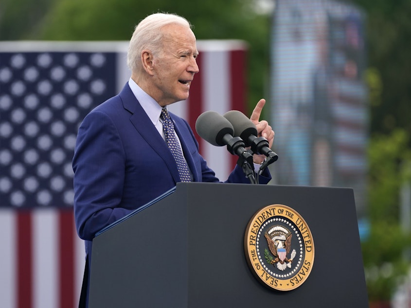 caption: President Biden says America has "to deal with" the aftereffects of slavery and Jim Crow laws