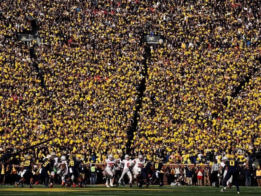caption: The NCAA and its Power 5 conferences agreed this week to a legal settlement that could allow for schools to pay athletes directly.
